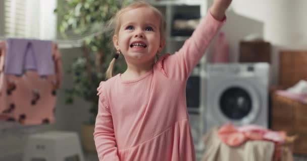 Sweet Little Girl Plays Laundry Room Bathroom Next Laundry Basket — ストック動画