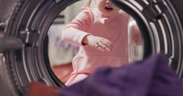 Little Girl Looks Interior Modern Washing Machine Pulls Clothes Bedding — Video