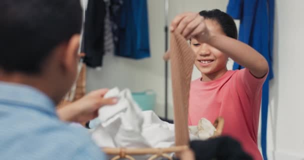 Younger Brother Sister Sort Clothes Washed Appropriate Colors Spending Time — Video