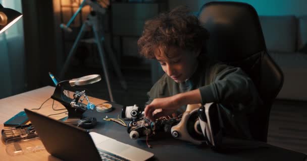 Portrait Boy Spending Time Room Desk Repairing Robot Screwing Screws — Stockvideo