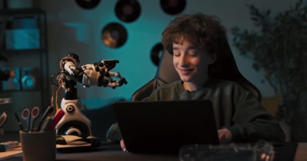 Smiling Boy Curly Hair Spends Time Playing Toy Assembles Robot — Videoclip de stoc