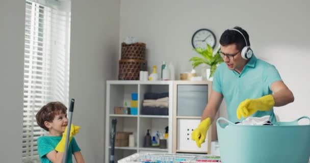 Fun Laundry Room Dad Son Doing Household Chores Fooling While — Stockvideo