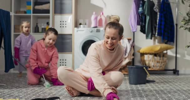 Concept Cleaning Home Child Mom Sits Bathroom Floor Laundry Room — 图库视频影像
