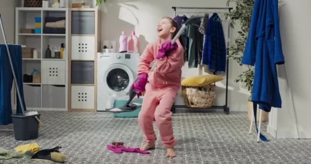 Little Girl Mops Floor Morning She Fools Plays Brush Guitar — Vídeo de stock