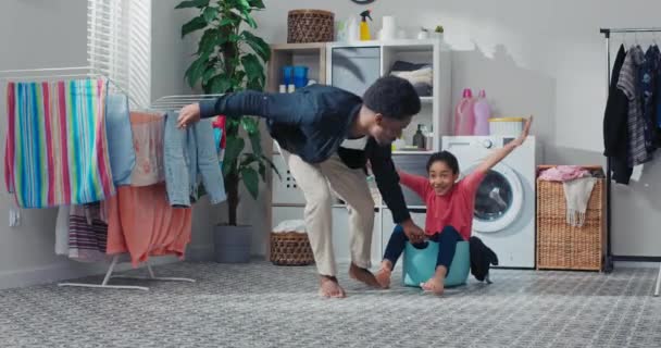 Fathers Play Child Laundry Room Bathroom While Doing Household Chores — Stockvideo