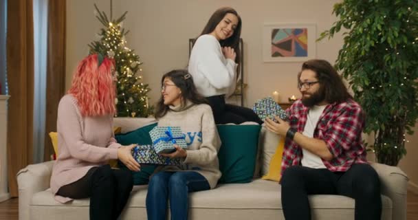 Fellow Students Sit Sofa Give Each Other Christmas Presents Guy — ストック動画
