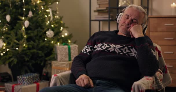 Christmas Party Exhausted Middle Aged Man Sat Chair Christmas Tree — Stock Video