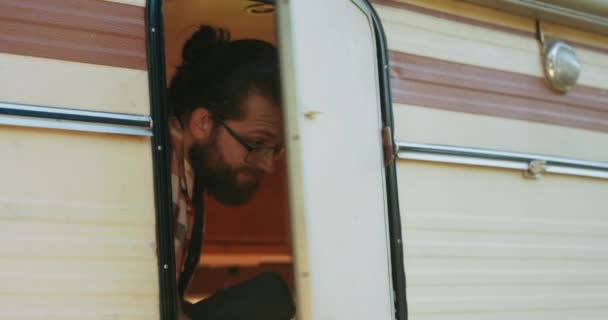 Young Male Hipster Opens Camper Door Looks Out Shouts Friends — Stock Video