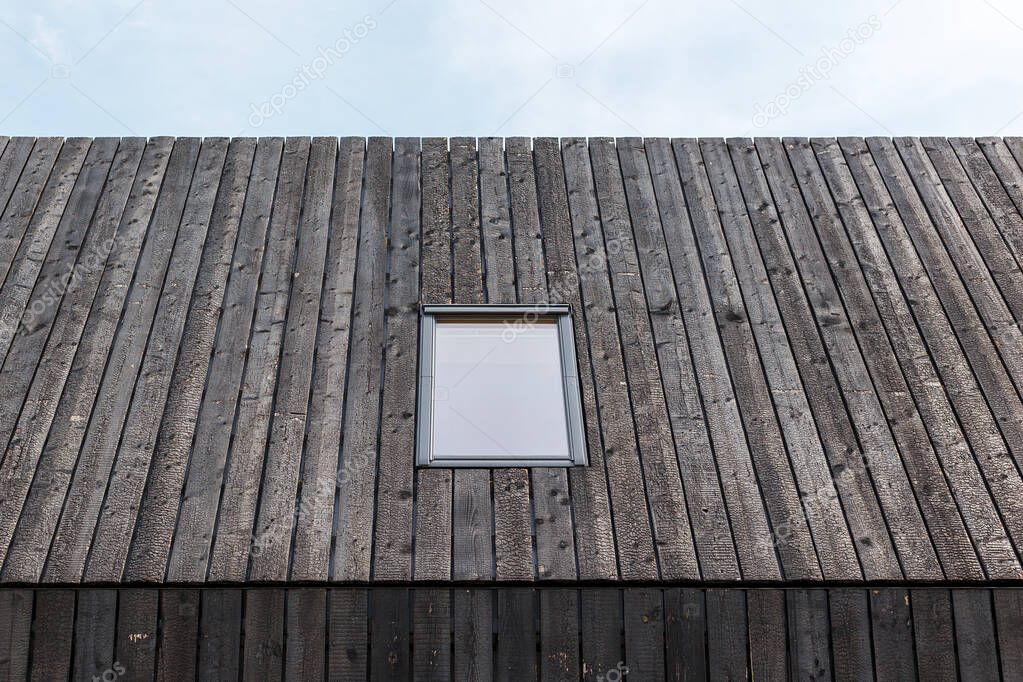 Building facade made of burnt wooden boards