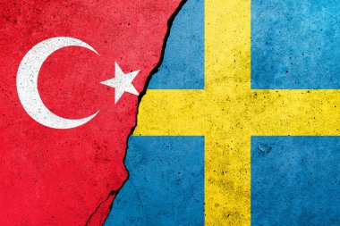 Beton duvara Türkiye ve İsveç bayrakları