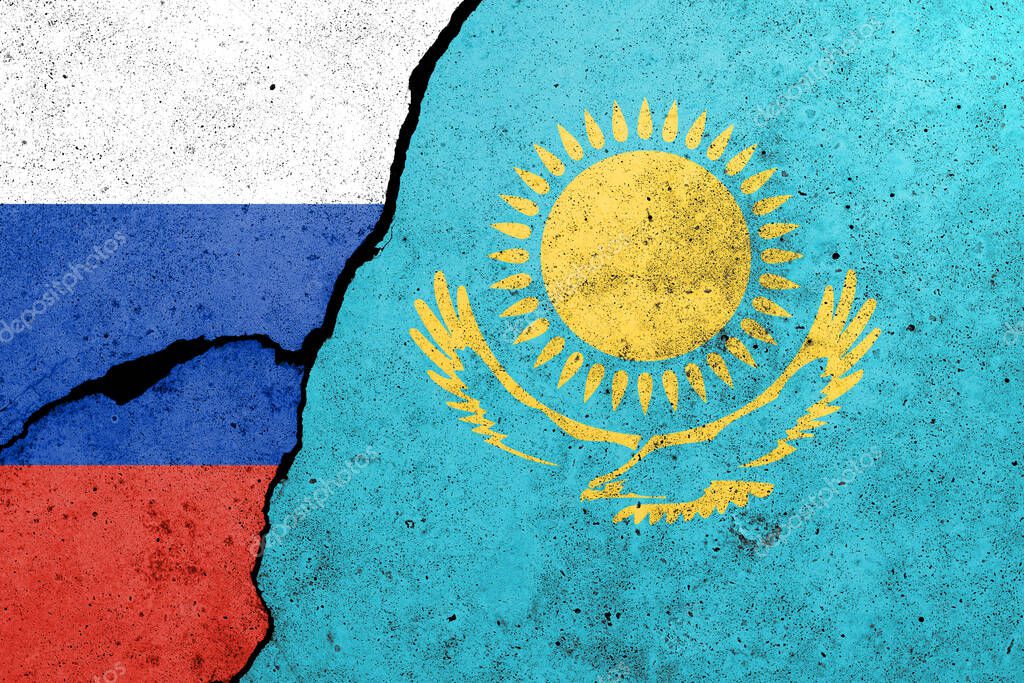 Russia and Kazakhstan flags painted on a concrete wall. Relationship between Kazakhstan  and Russia