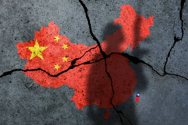 China and Taiwan flag map painted on a concrete wall with soldier shadow