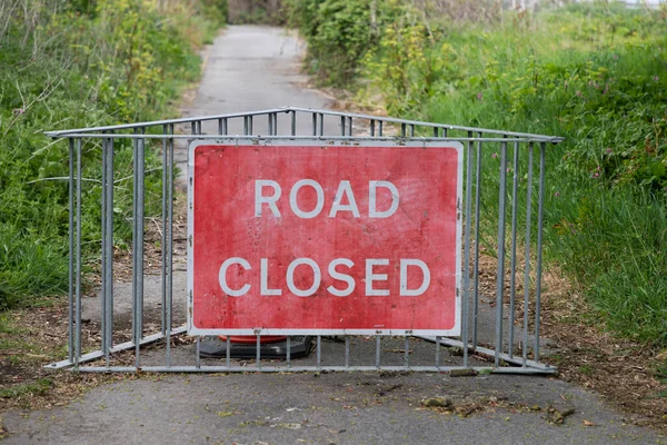 UK Road Closed Sign advising of a closed road due to coastal erosion in Happisburgh, North Norfolk in the UK