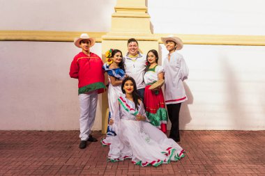 Teenage dancers of typical Central American dance with their teacher