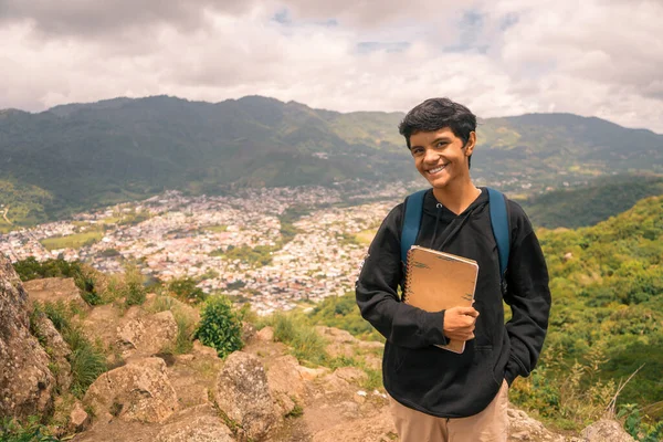 Latin college freshman smiling and looking at camera. Photo with copy space