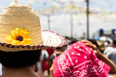 Man with a hat with a sunflower in the traditional festivities of Santo Domingo Managua Nicaragua