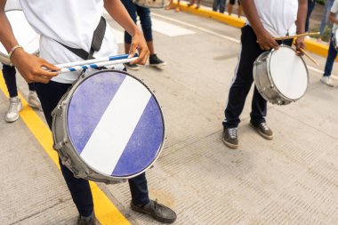 Teenagers from Latin America celebrating the national holidays with drums