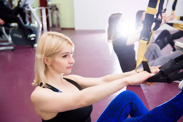 Group having functional fitness training in sport gym.