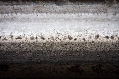Train track texture. A macro fragment of a railway track. Metal fragment. High quality photo