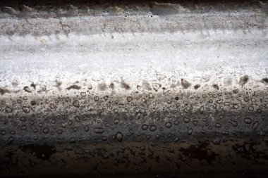 Train track texture. A macro fragment of a railway track. Metal fragment. High quality photo