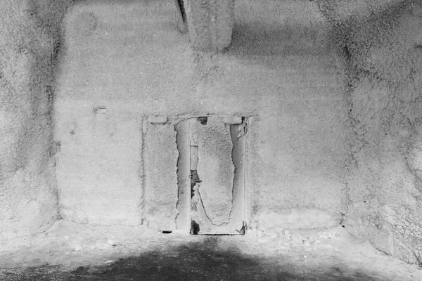 Svalbard Frozen door inside Global Seed Vault at Svalbard archipelago. The worlds largest seed storage, opened by the Norwegian Government in 2008. Black and white photo.