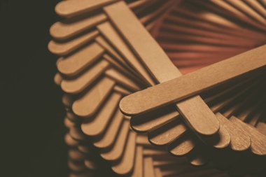 close up shot of a row of wood sticks