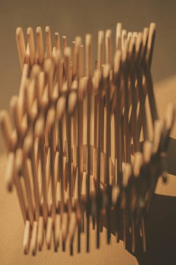 close up shot of a row of wood sticks