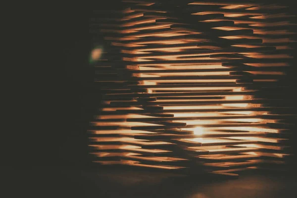 close up shot of a row of wood sticks