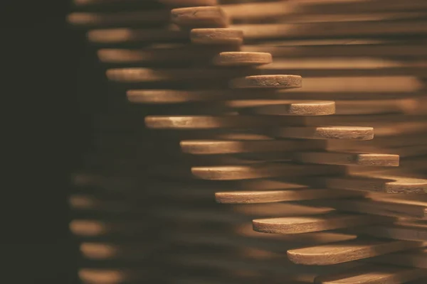 close up shot of a row of wood sticks