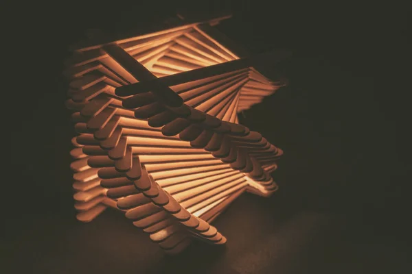 close up shot of a row of wood sticks