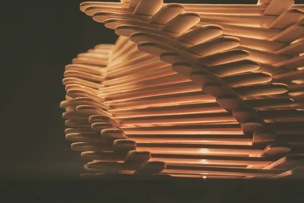 close up shot of a row of wood sticks