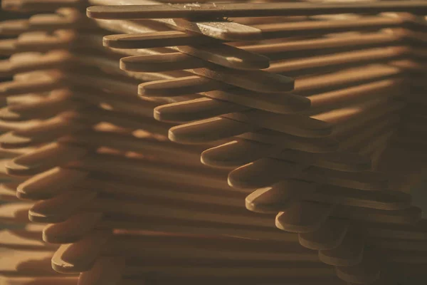 close up shot of a row of wood sticks