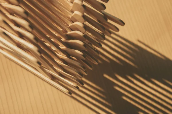 close up shot of a row of wood sticks
