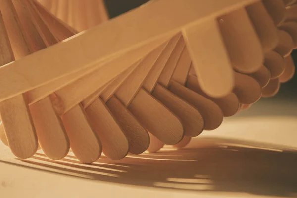 close up shot of a row of wood sticks