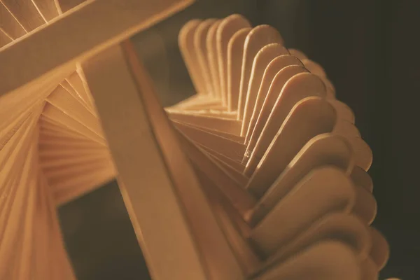 close up shot of a row of wood sticks