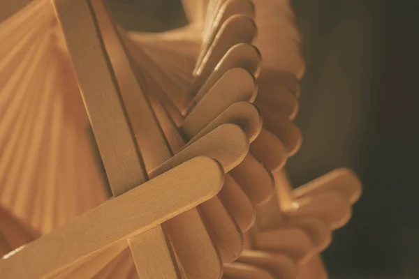 close up shot of a row of wood sticks