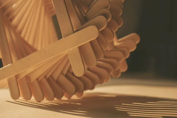 close up shot of a row of wood sticks