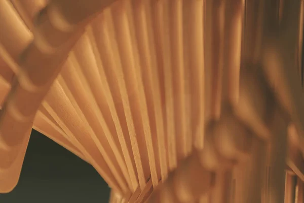 close up shot of a row of wood sticks