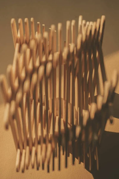 close up shot of a row of wood sticks