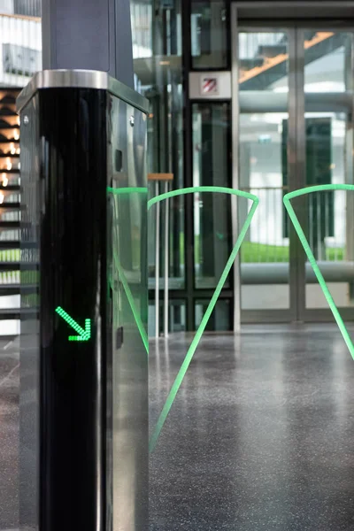 Automatic glass gate with an id card checking system in a modern public space such as airport, railway station and office building.
