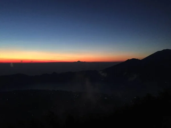 beauty and amazing sunrise view in top of batur mount bali