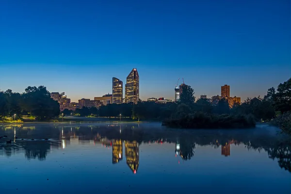 Dawn at La Defense District With Towers Skyline Lake Reflections and Trees