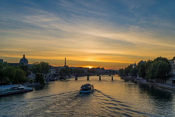 Boats Cruises Over Seine River at Sunset in Paris With Eiffel Tower From Notre Dame District