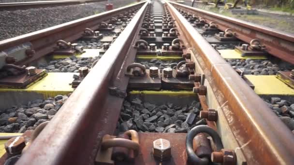 Railroad Tracks Passed Yellow Grooved Bearings Buried Small Shards Rock — Stock Video