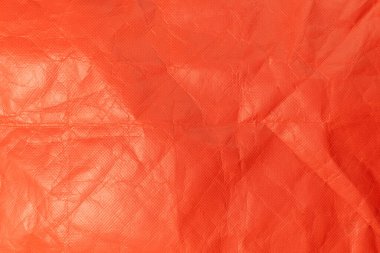 Kırmızı delikli kağıt. Kırmızı remi kağıdın yapısı yakın plan. Kağıt üzerinde delik