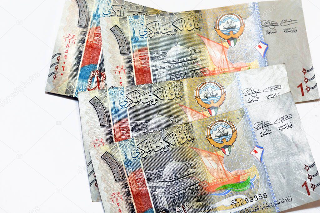 Obverse side of 1 KWD one Kuwaiti dinar bill banknotes feature the image of the grand mosque and a bateel dhow ship, Kuwaiti dinar is the currency of the State of Kuwait isolated on white background