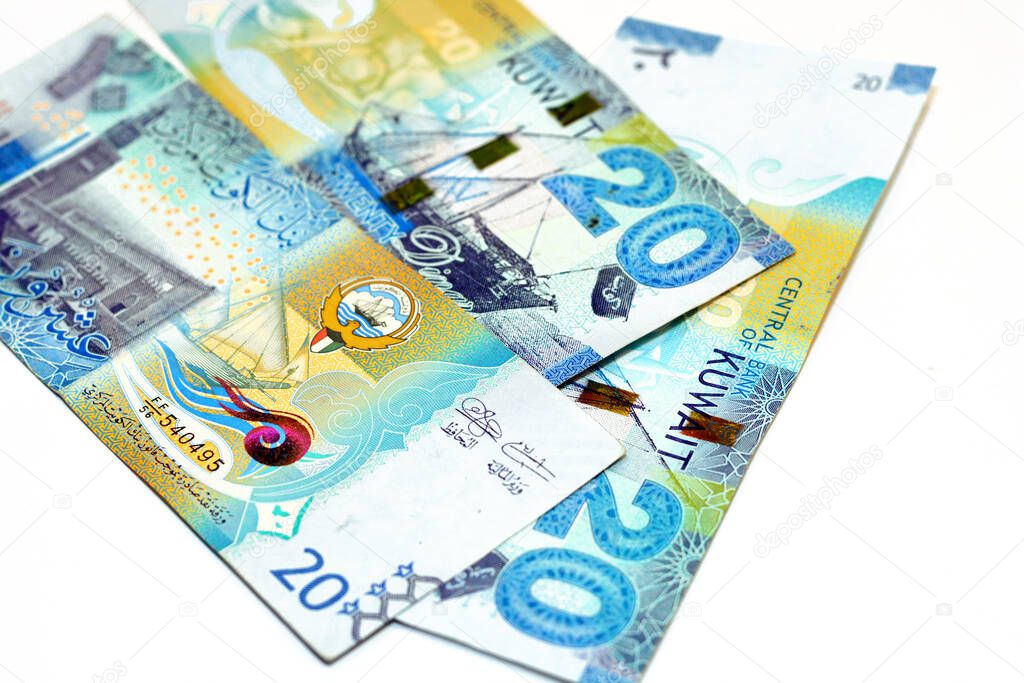 Twenty Kuwaiti dinars bill banknote 20 KWD features Seif Palace, a dhow ship, Kuwaiti pearl diver and Al-Boom traditional Kuwaiti dhow ship, Kuwaiti dinar currency of the State of Kuwait isolated on white background