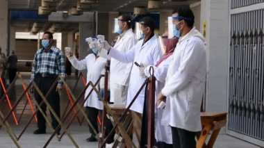 Cairo, Egypt, March 6 2021: Footage of strict precautionary measures before a university building entry, face masks and temperature checking amid covid-19 coronavirus global crisis epidemic outbreak