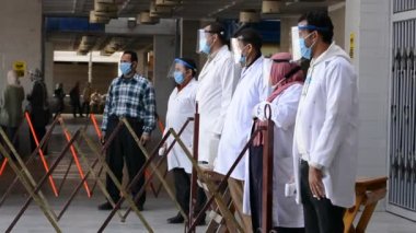 Cairo, Egypt, March 6 2021: Footage of strict precautionary measures before a university building entry, face masks and temperature checking amid covid-19 coronavirus global crisis epidemic outbreak