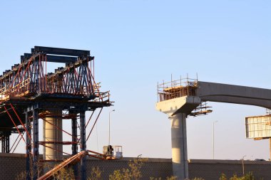 Cairo, Egypt, July 17 2022: A construction site of Egyptian new project of monorail overhead transport system, columns and tracks of Cairo monorail that is under construction, selective focus